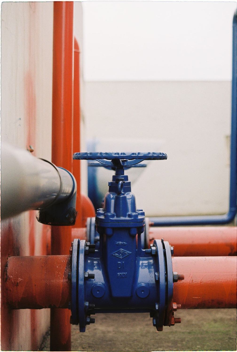 Blue gate valve fitted to red process piping