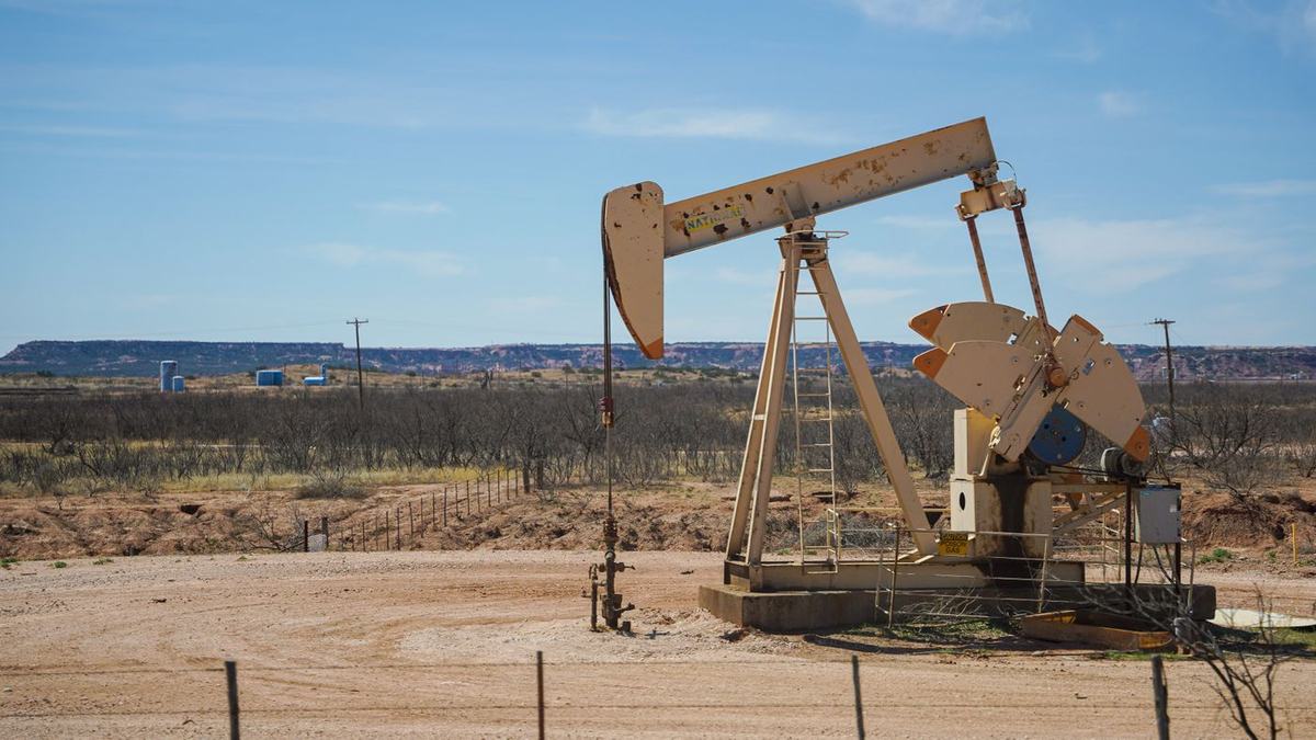 Oil well pumpjack in a desert field